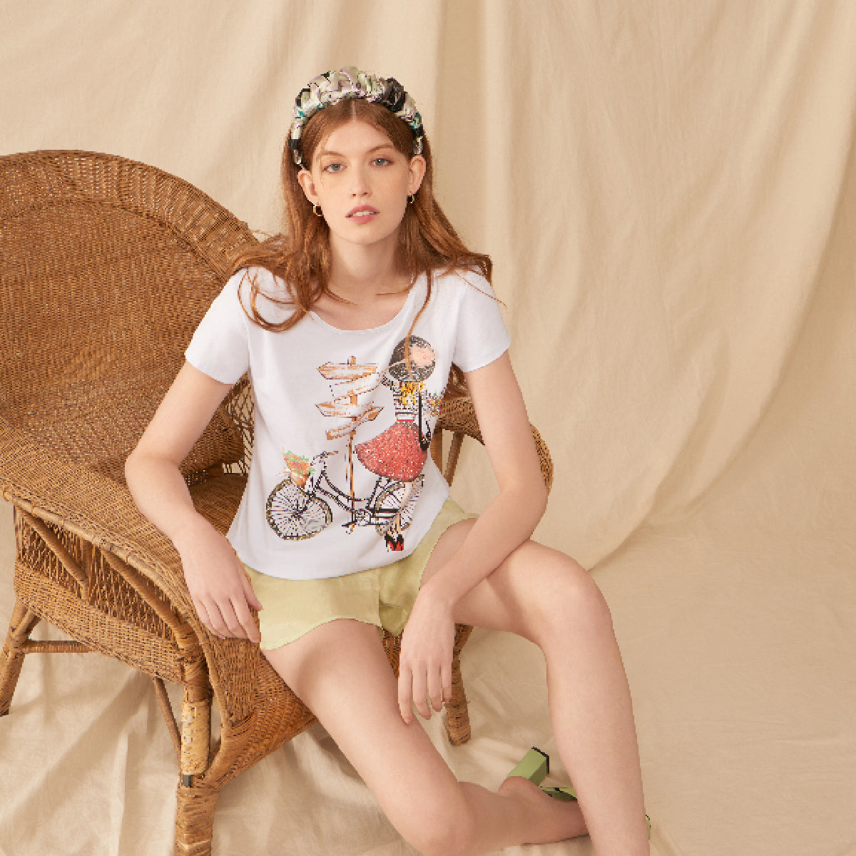 SHORT SLEEVED TOP WITH EMBELLISHED LADY WITH A BIKE
